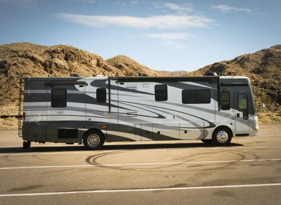 ARIZONA - OCTOBER 31, 2017: Self-propelled recreational vehicle parking in the desert.   RV offers living accommodation combined with a vehicle engine and is a common way to tour the US from coast to coast.